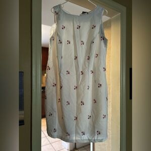 worn dress a little stain on the back that is faded